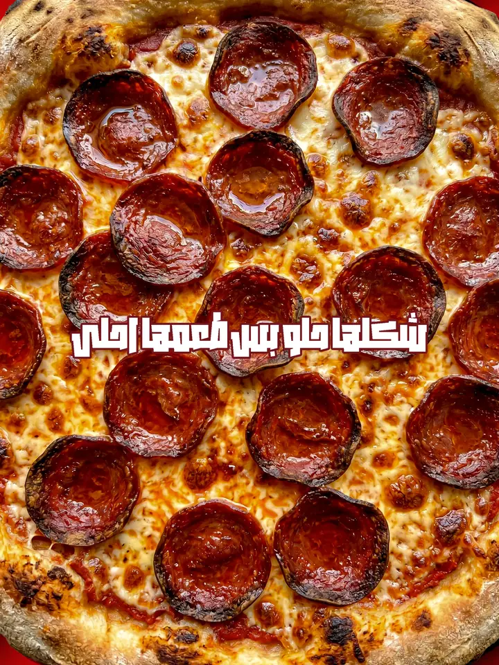 Close up food photography: pepperoni pizza with charred edges and melted cheese