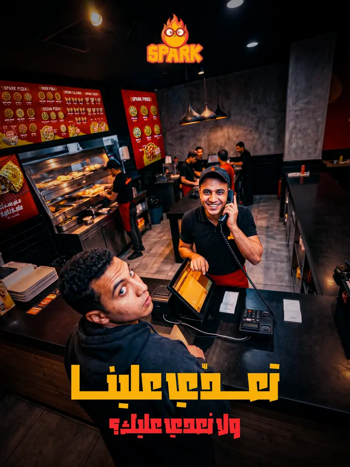 Social ad for a pizza restaurant: a crew member taking a phone order inside the branch